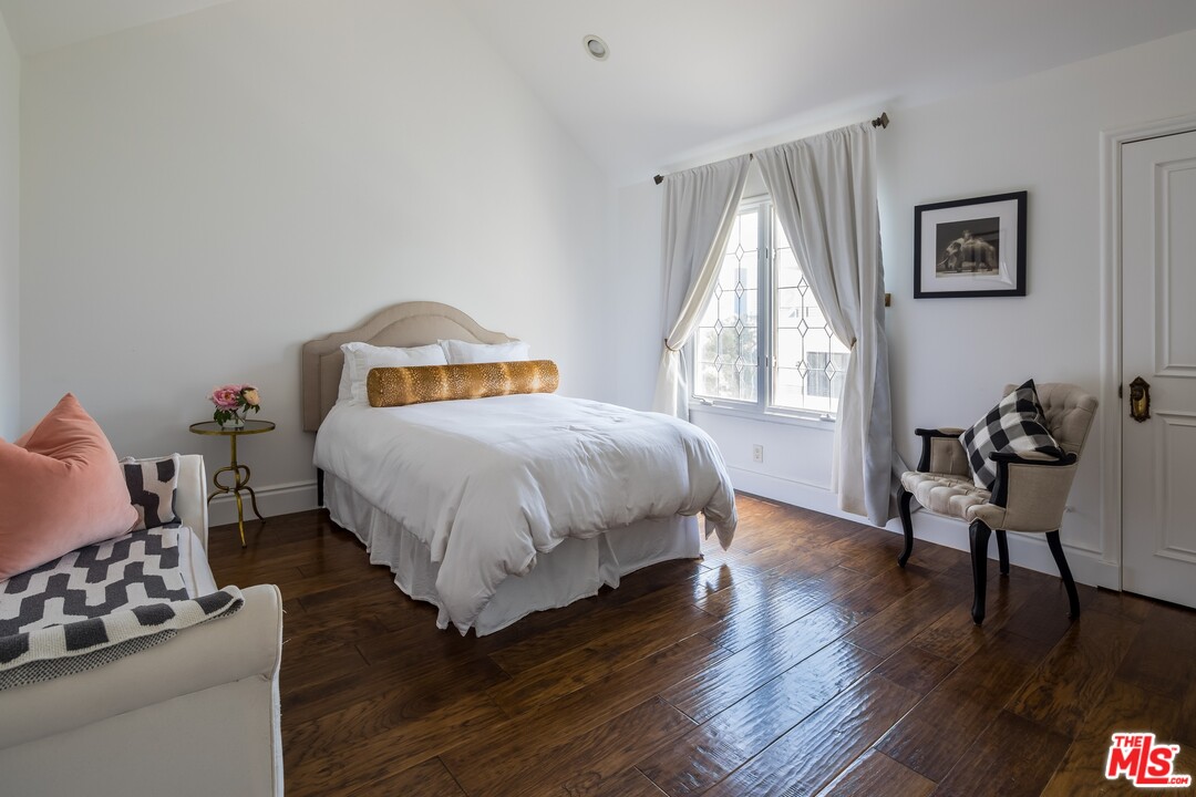 129 Roma Court Marina del Rey, CA 90292 - Photo 31 of 42 a bedroom with a bed and wooden floor
