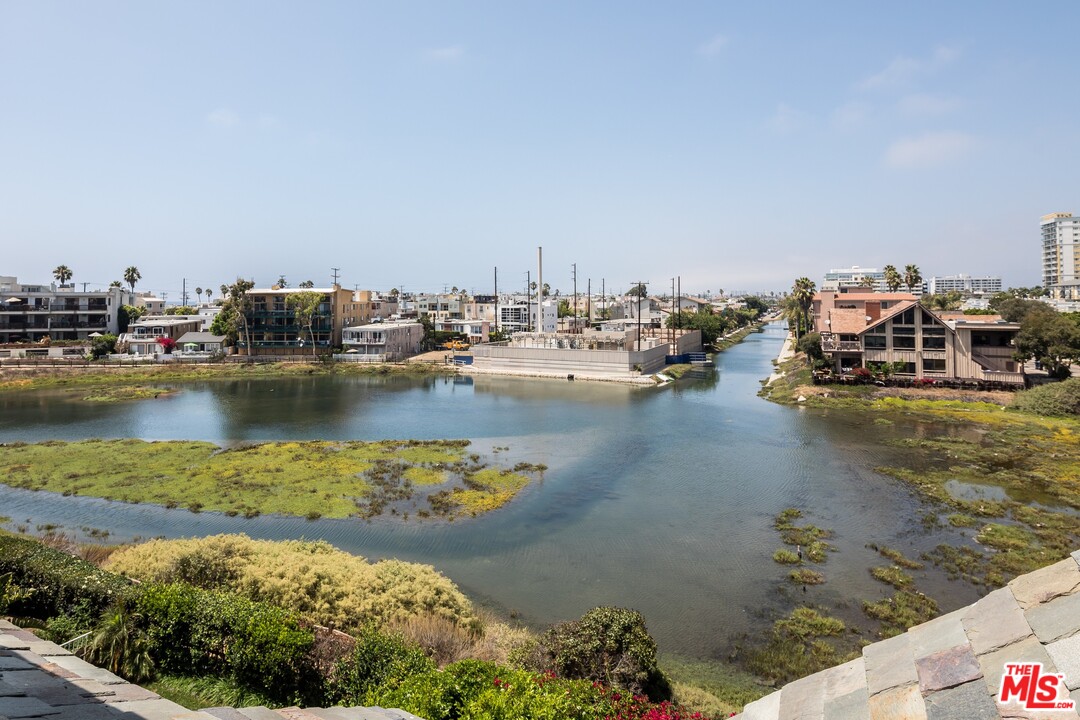 129 Roma Court Marina del Rey, CA 90292 - Photo 38 of 42 a view of a lake with boats and trees in the background