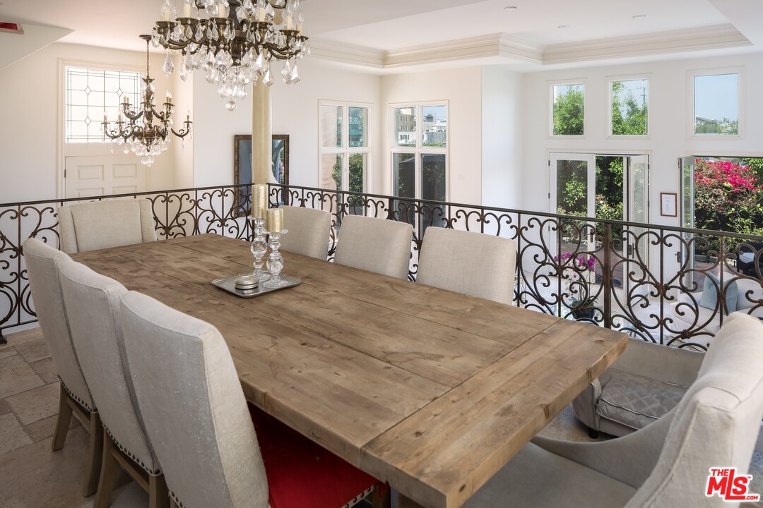 129 Roma Court Marina del Rey, CA 90292 - Photo 10 of 42 a view of a dining room with furniture and a chandelier