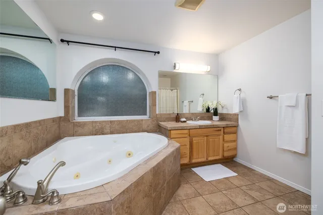 a bathroom with a bathtub and a sink