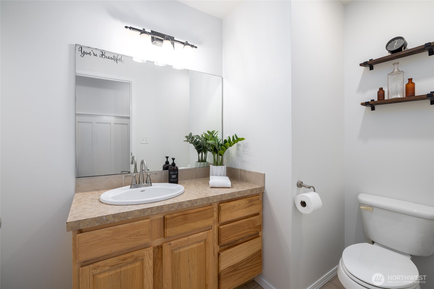 19366 Parson Creek Road Burlington, WA 98233 - Photo 20 of 31 a bathroom with a sink a toilet and mirror