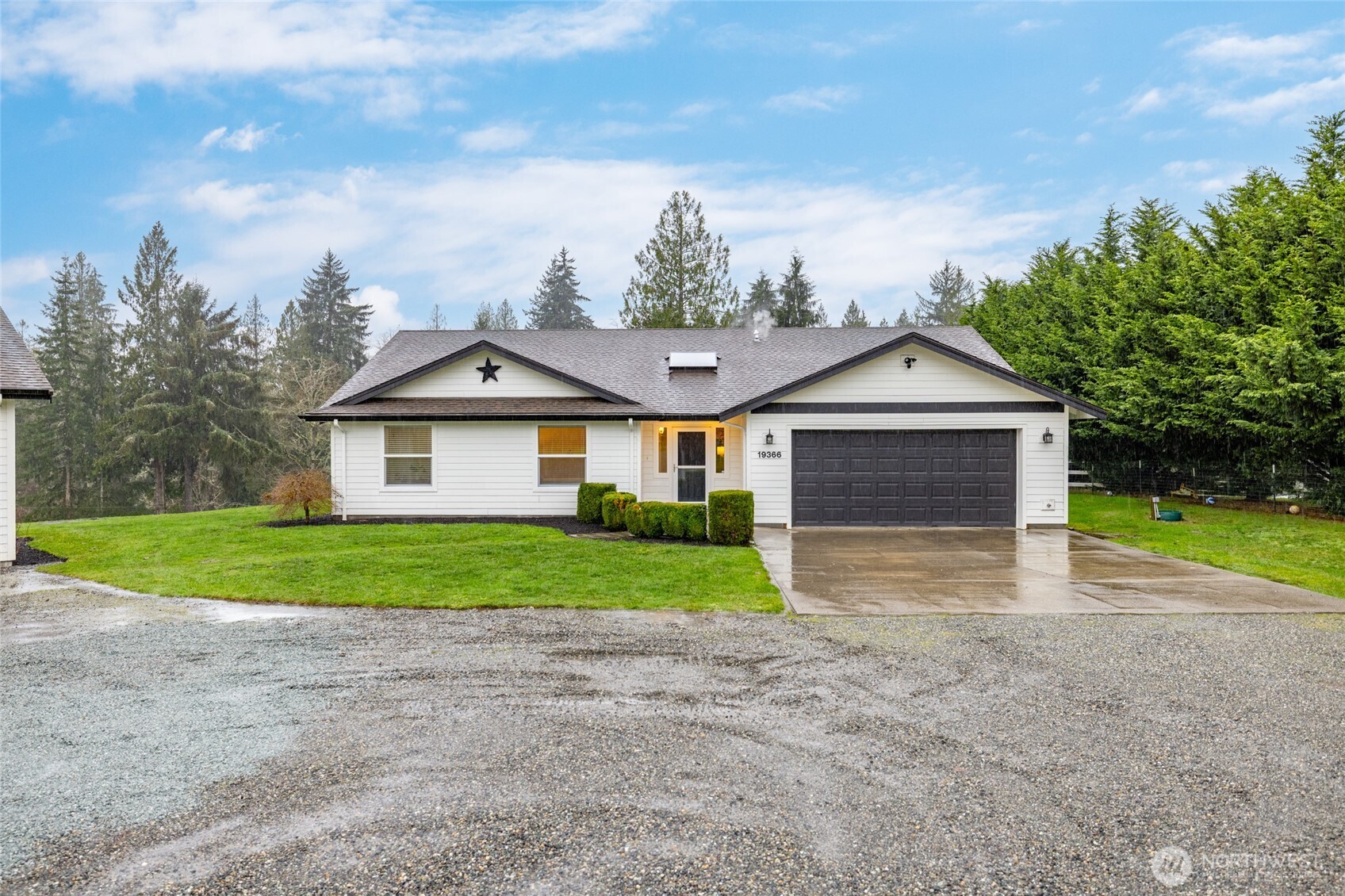 19366 Parson Creek Road Burlington, WA 98233 - Photo 2 of 31 a view of a yard in front of a house with large trees