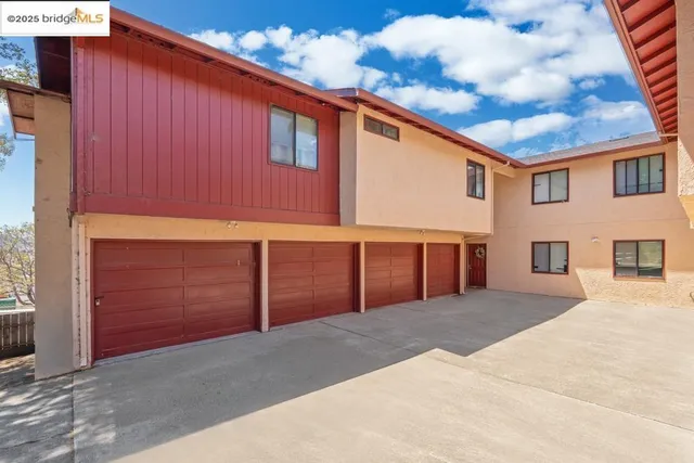 a front view of a house with a garage