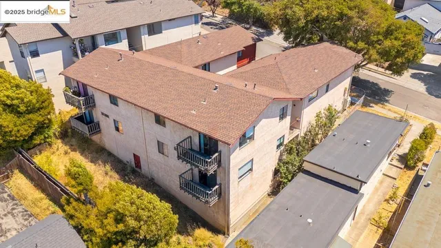 a aerial view of a house with large trees