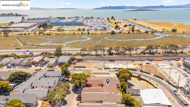 an aerial view of residential building and ocean