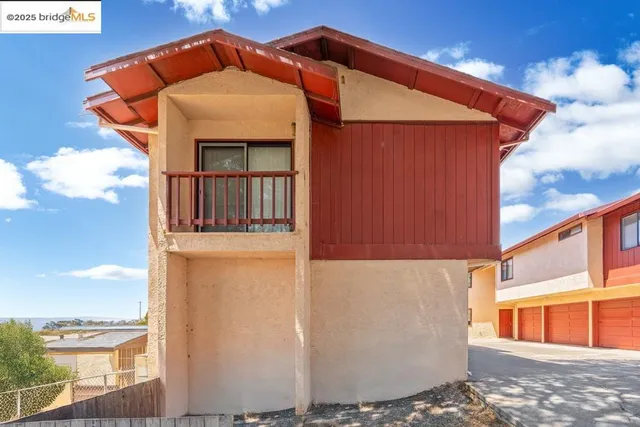 a front view of a house with glass windows