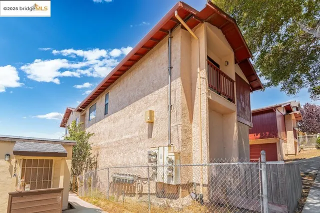 a view of a house with a small yard