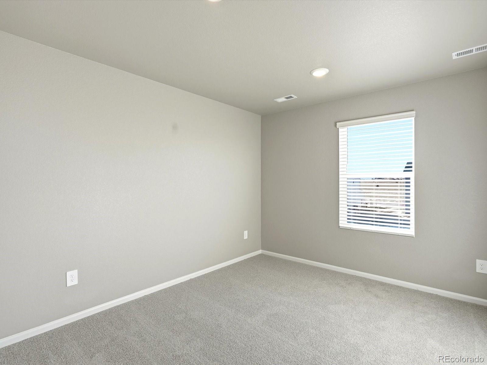 7317 West 27th St Road Greeley, CO 80634 - Photo 18 of 28 an empty room with a window
