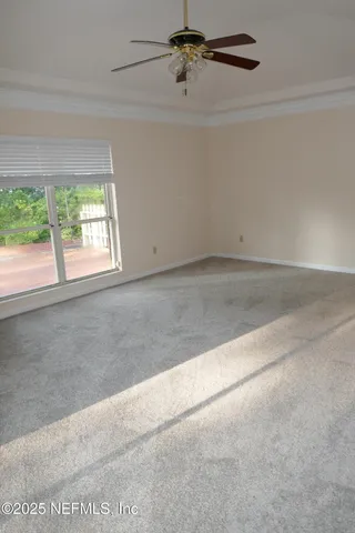 an empty room with a empty space and windows