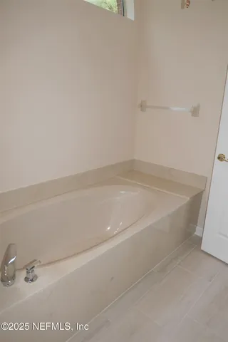 a view of a bath tub sitting in a bathroom
