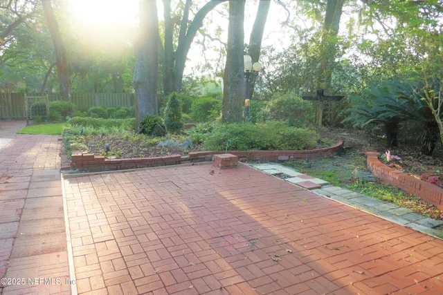 a view of a backyard with garden