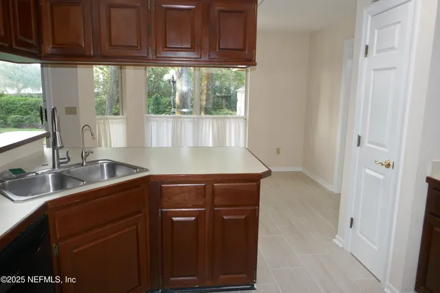 a kitchen with a sink and cabinets