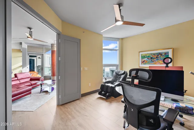 a bedroom with a bed couch and a window