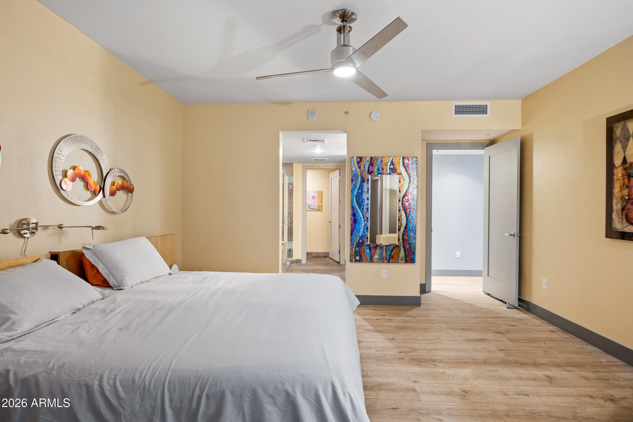 140 East Rio Salado Parkway, Unit 610 Tempe, AZ 85281 - Photo 14 of 57 a bedroom with a bed and a large mirror