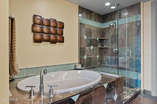a bathroom with a shower and a sink