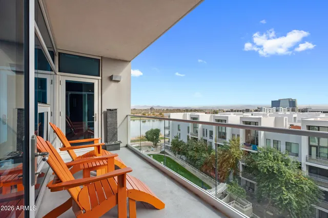 a view of a balcony with chairs