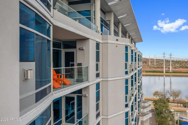 a view of a balcony with furniture