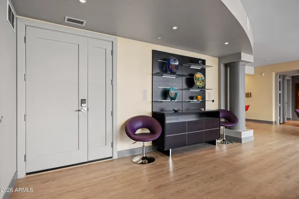 a dining room with furniture and window