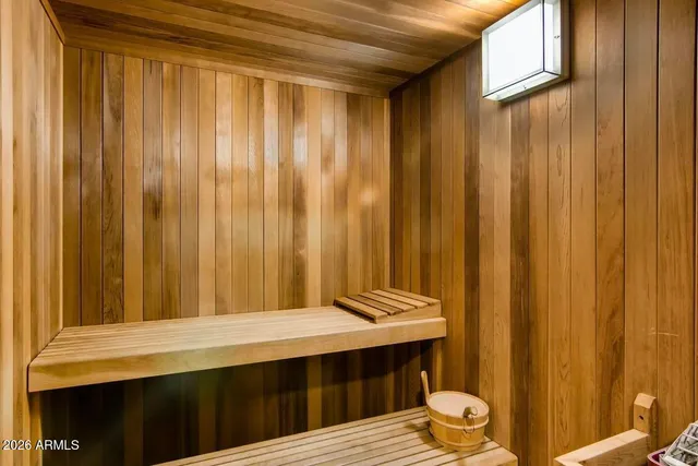 a view of a patio with couches table and chairs and potted plants