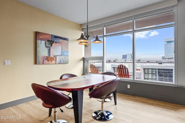 a living room with furniture and kitchen view