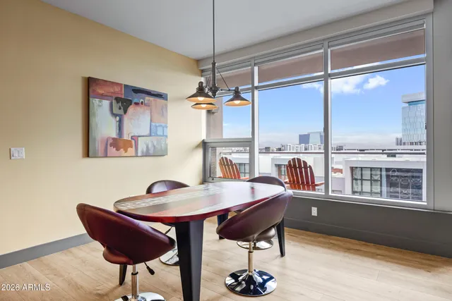 a living room with furniture and kitchen view