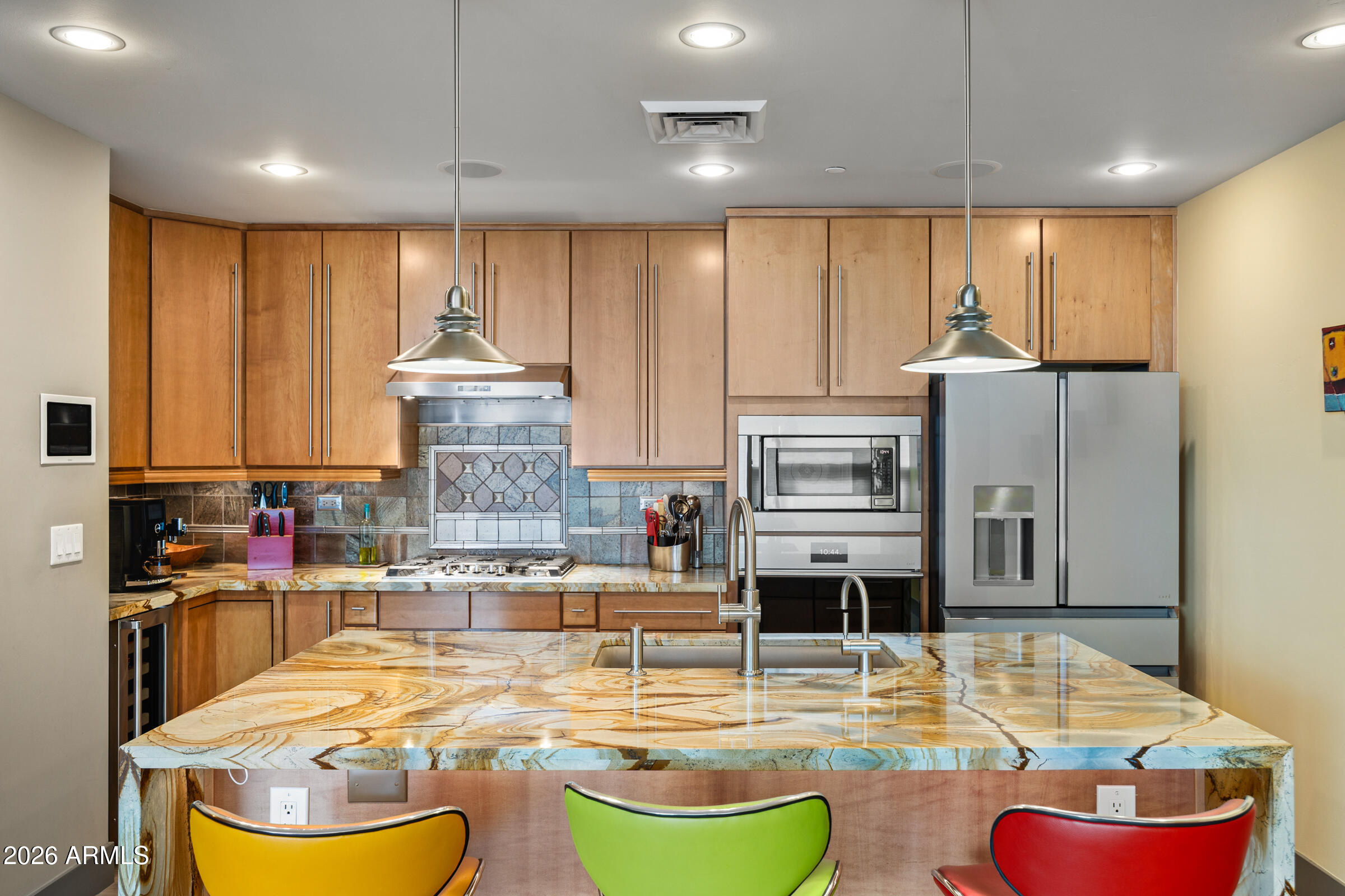 140 East Rio Salado Parkway, Unit 610 Tempe, AZ 85281 - Photo 6 of 57 a room with kitchen island granite countertop a stove and a refrigerator