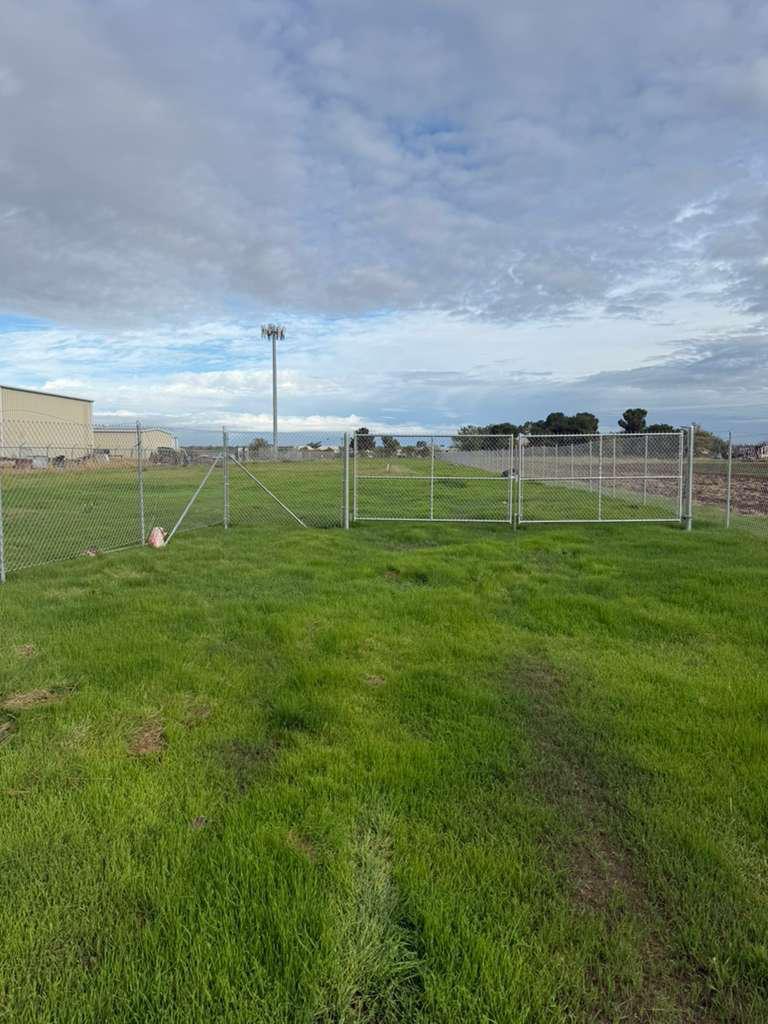 446 Tyler Road, Unit 148 Merced, CA 95341 - Photo 4 of 4 a green field with lots of trees in it