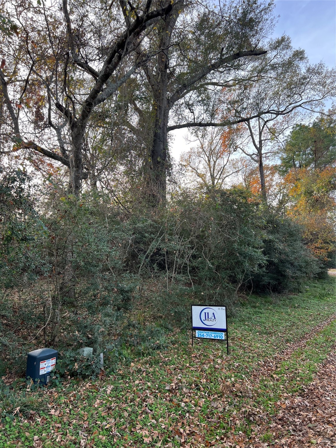 Tbd Bay Hill Road Point Blank, TX 77364 - Photo 4 of 21 a sign that is sitting in the middle of a forest