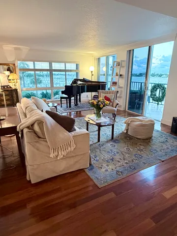 a room with furniture pool view and a large window