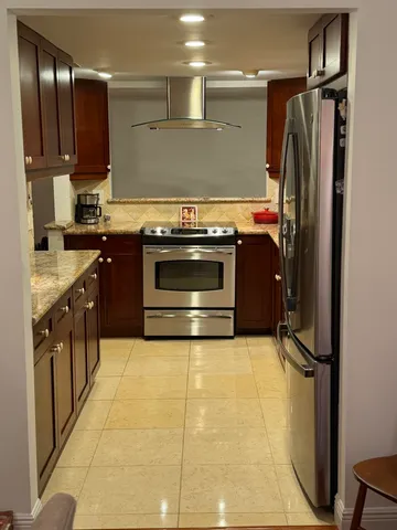 a kitchen with granite countertop lots of counter top space