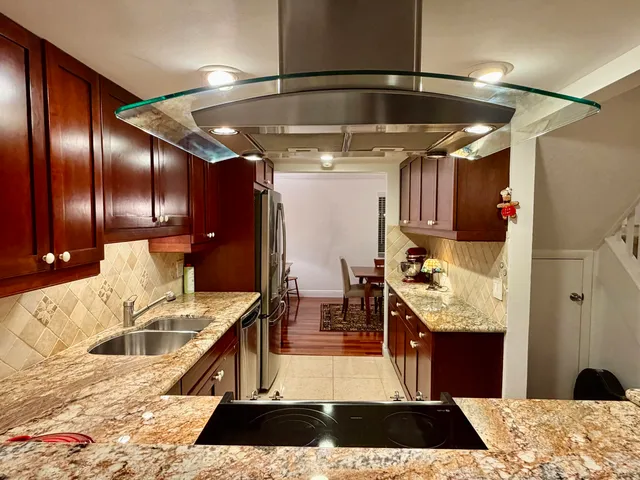 a kitchen with a sink and a stove