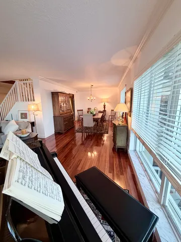 a bedroom with bed and a large window