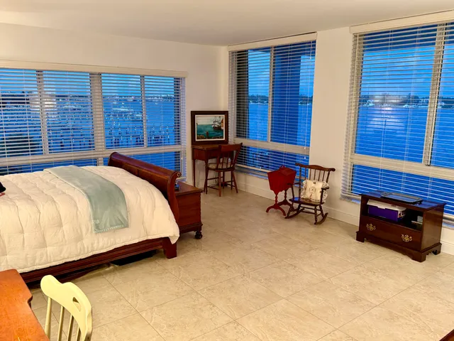 a bedroom with furniture and a lamp