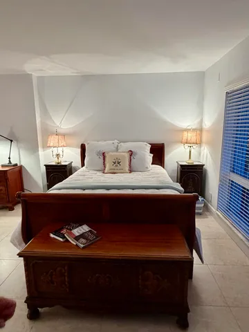 a bed room with a bed and a couch