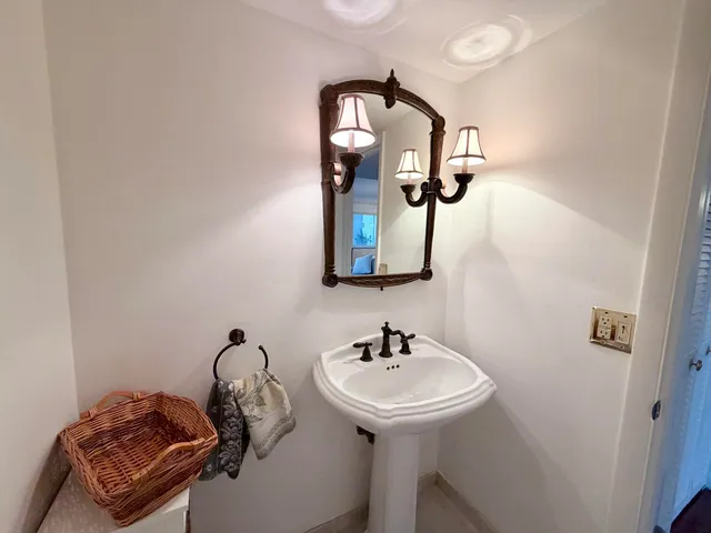 a bathroom with a sink and mirror