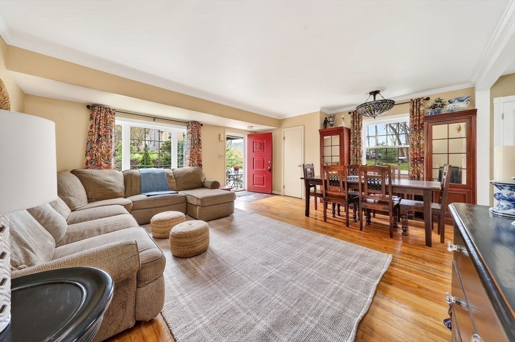 15 Leigh Road Norwell, MA 02061 - Photo 4 of 34 a living room with furniture and a dining table next to a large window