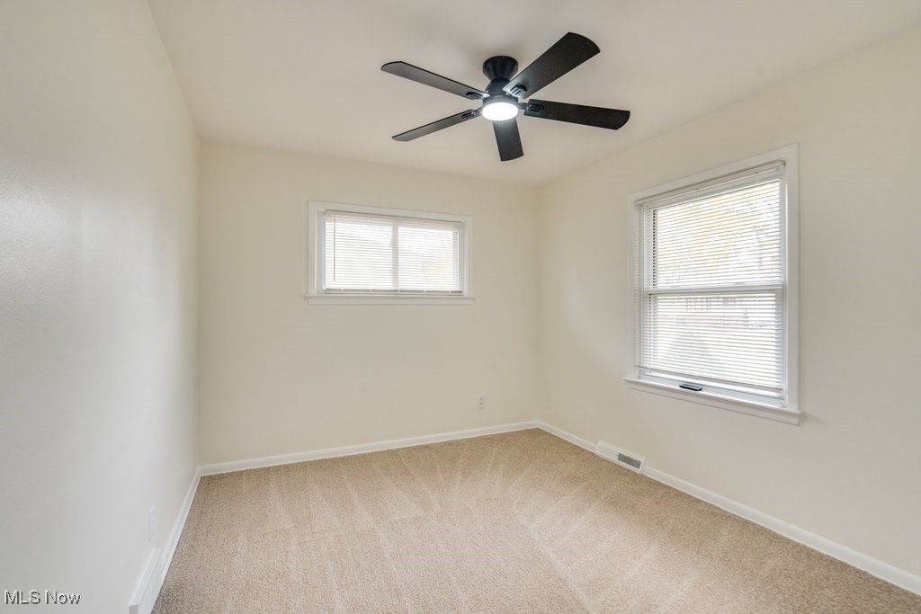 6961 Maplewood Road Parma Heights, OH 44130 - Photo 12 of 22 Spare room featuring light colored carpet and ceiling fan