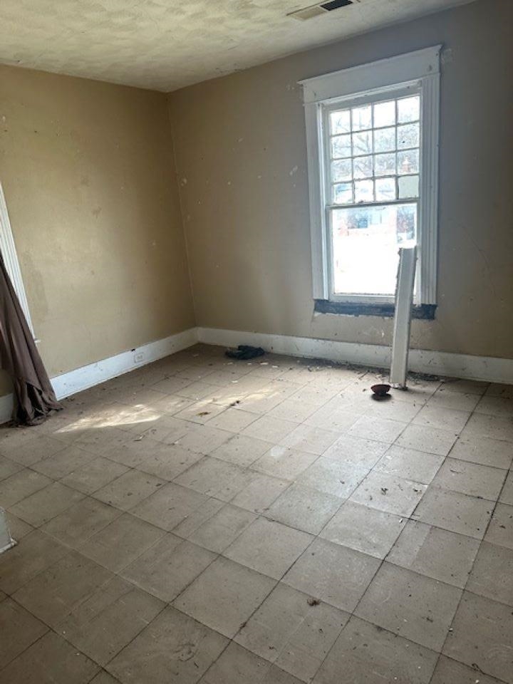 942 Roland Street, Unit 3 Memphis, TN 38114 - Photo 11 of 13 Empty room with baseboards