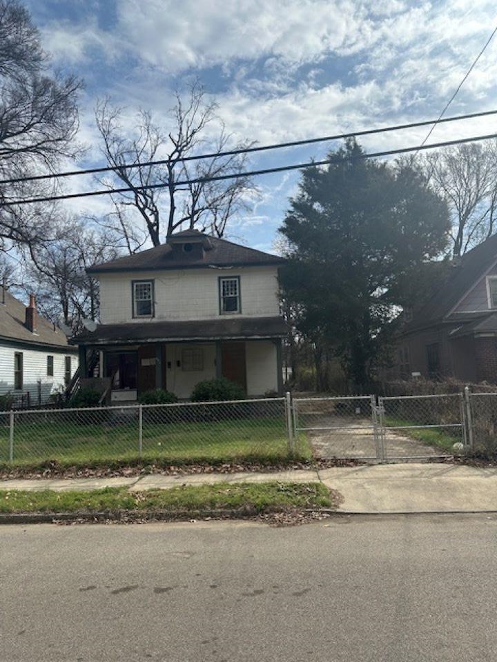 942 Roland Street, Unit 3 Memphis, TN 38114 - Photo 2 of 13 Traditional style home featuring a porch, a gate, and a fenced front yard