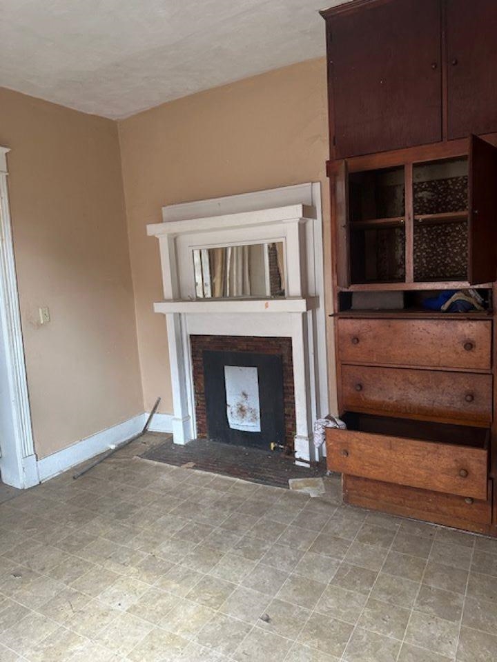 942 Roland Street, Unit 3 Memphis, TN 38114 - Photo 5 of 13 Living room with a fireplace with flush hearth and baseboards