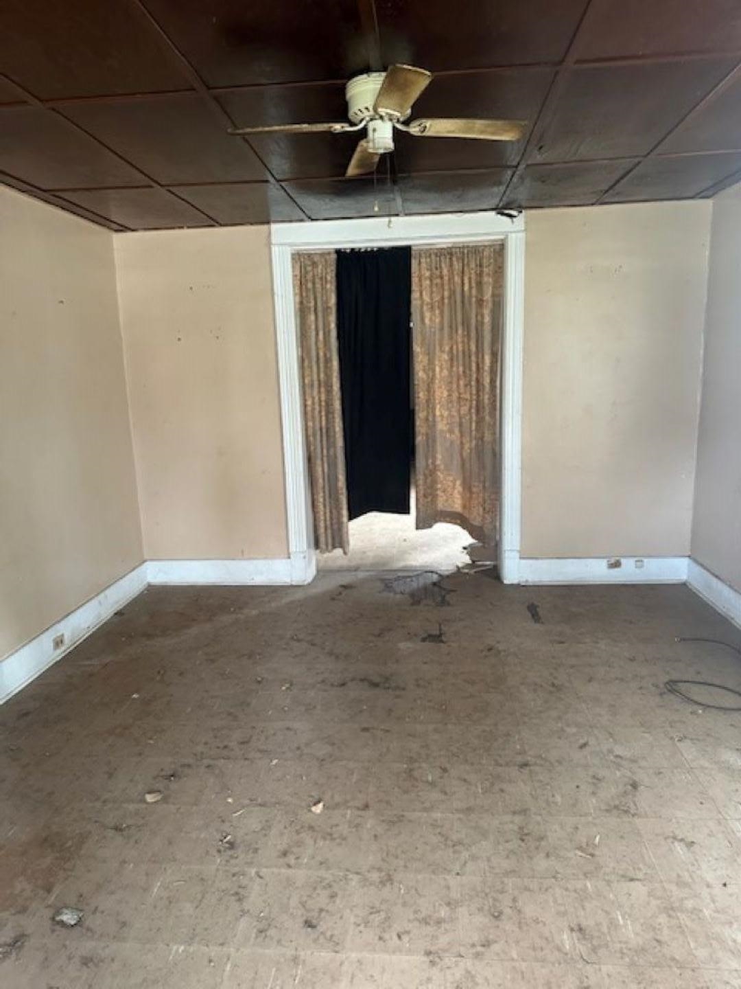 942 Roland Street, Unit 3 Memphis, TN 38114 - Photo 6 of 13 Empty room with a ceiling fan and baseboards