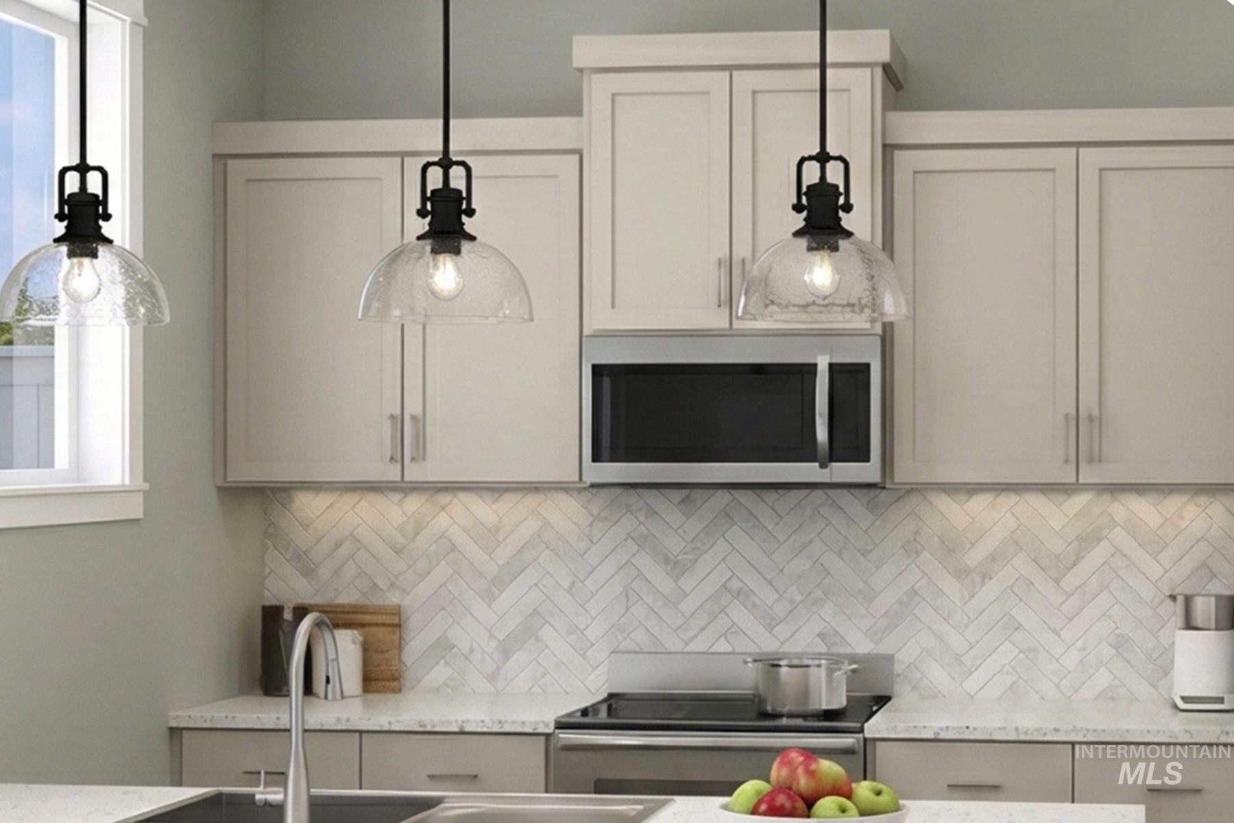 392 South Fritts Avenue Meridian, ID 83642 - Photo 2 of 9 Kitchen featuring light stone counters, stainless steel appliances, tasteful backsplash, and pendant lighting