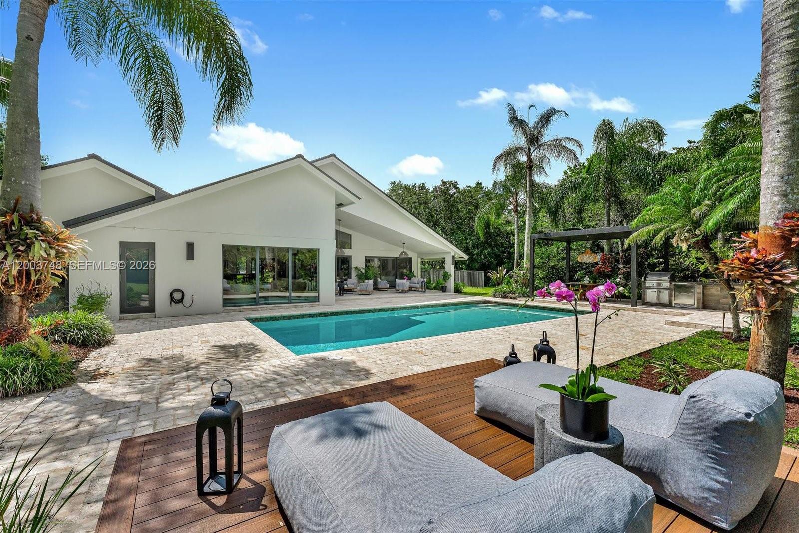2675 Hackney Road Weston, FL 33331 - Photo 26 of 61 a view of a house with backyard and sitting area