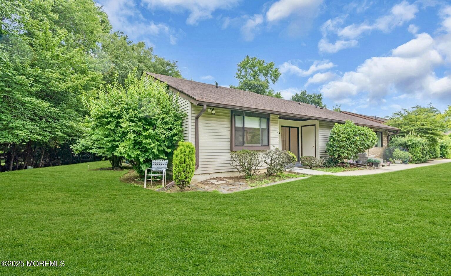 70 Overlook Way, Unit A Manalapan, NJ 07726 - Photo 10 of 13 a front view of a house with a yard