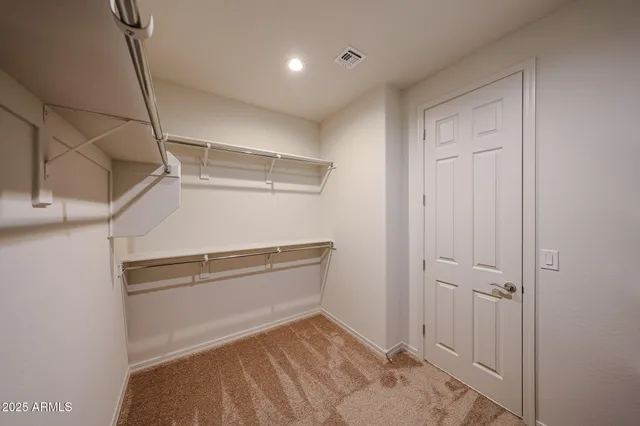 a view of storage and utility room with racks on the wall