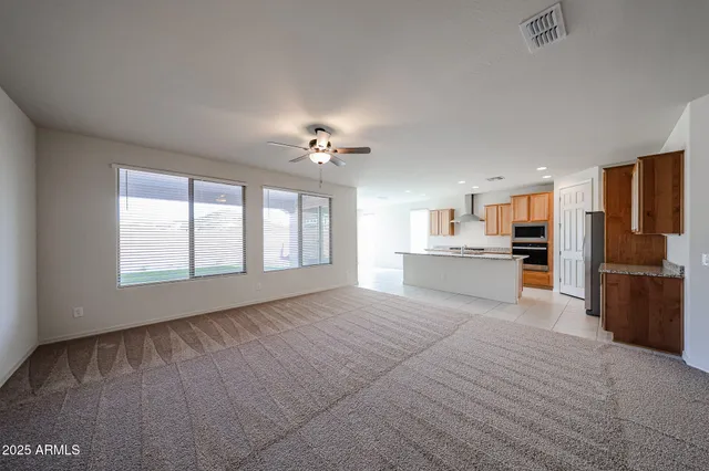 a view of a kitchen with microwave and windows