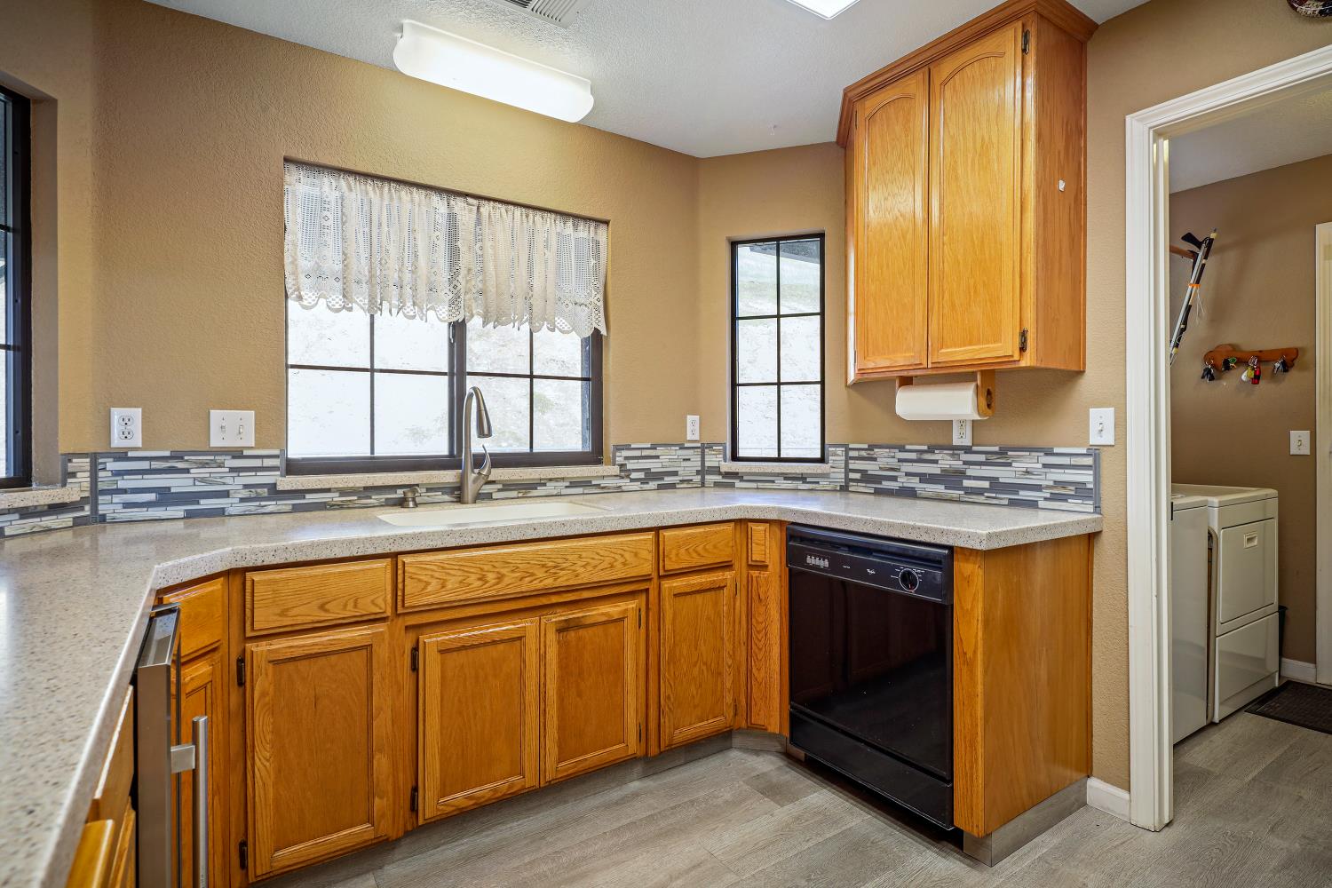 2 Katelyn Court Valley Springs, CA 95252 - Photo 23 of 98 a kitchen with stainless steel appliances granite countertop a stove a sink and a refrigerator