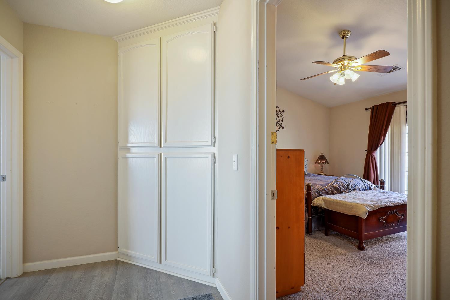 2 Katelyn Court Valley Springs, CA 95252 - Photo 32 of 98 a bedroom with a bed and ceiling fan