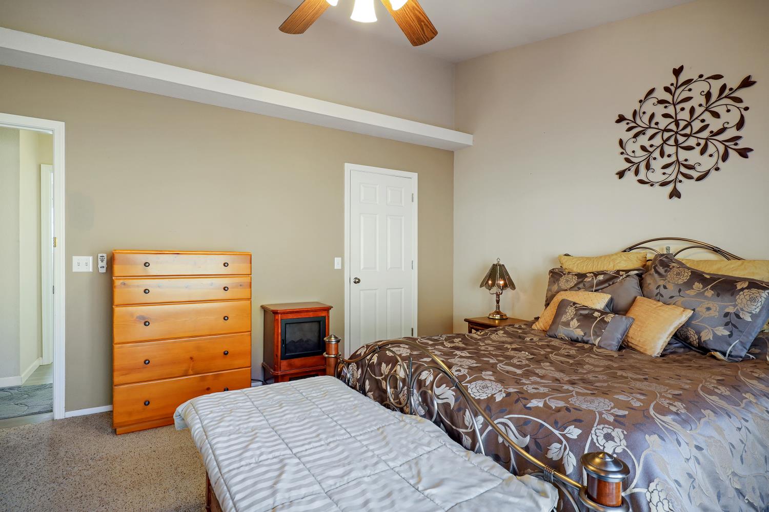 2 Katelyn Court Valley Springs, CA 95252 - Photo 36 of 98 a bedroom with a bed and a chandelier