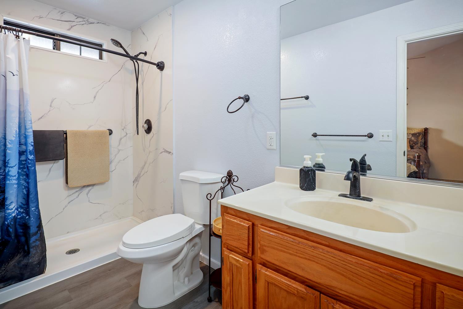 2 Katelyn Court Valley Springs, CA 95252 - Photo 37 of 98 a bathroom with a sink a toilet and shower